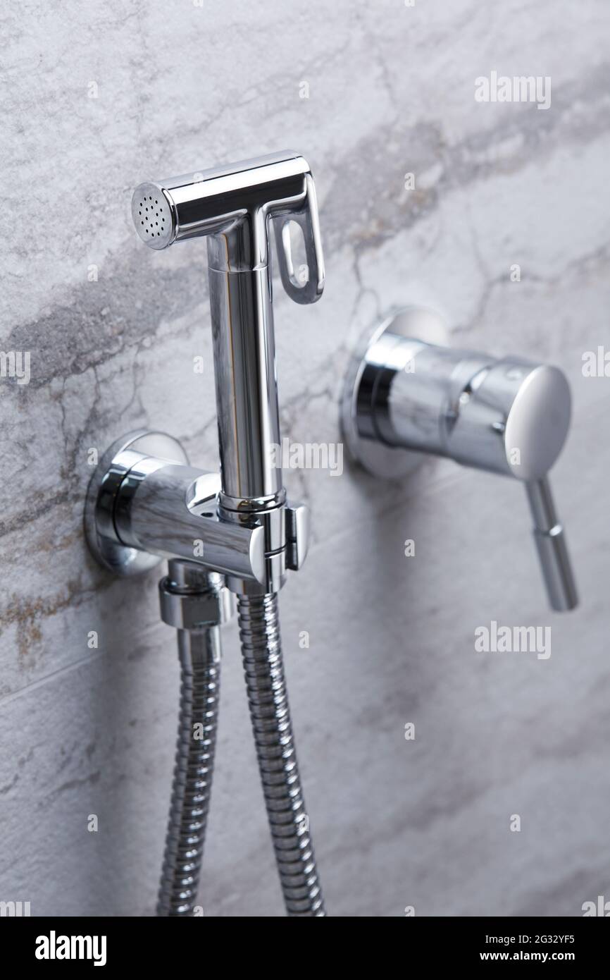 Bathroom water mixer. Water tap made of chrome material, Stock Photo