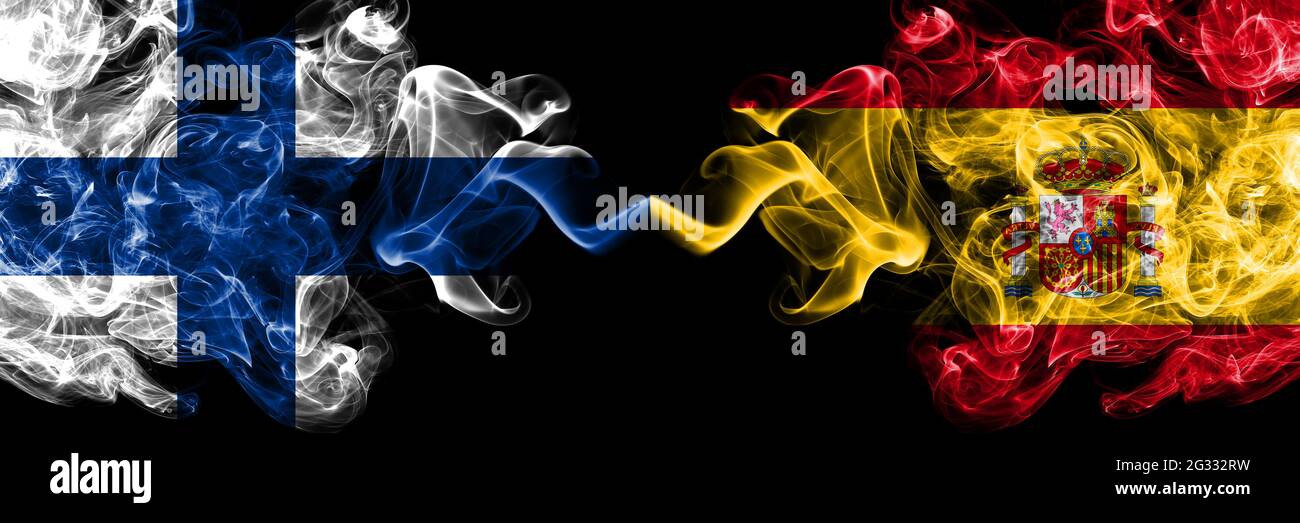 Finland, Finnish vs Spain, Spanish smoky flags side by side Stock Photo
