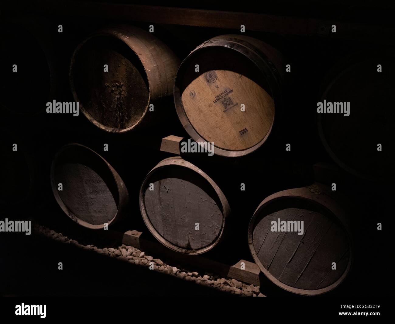 Old barrels of cider in a brewery basement. Stock Photo