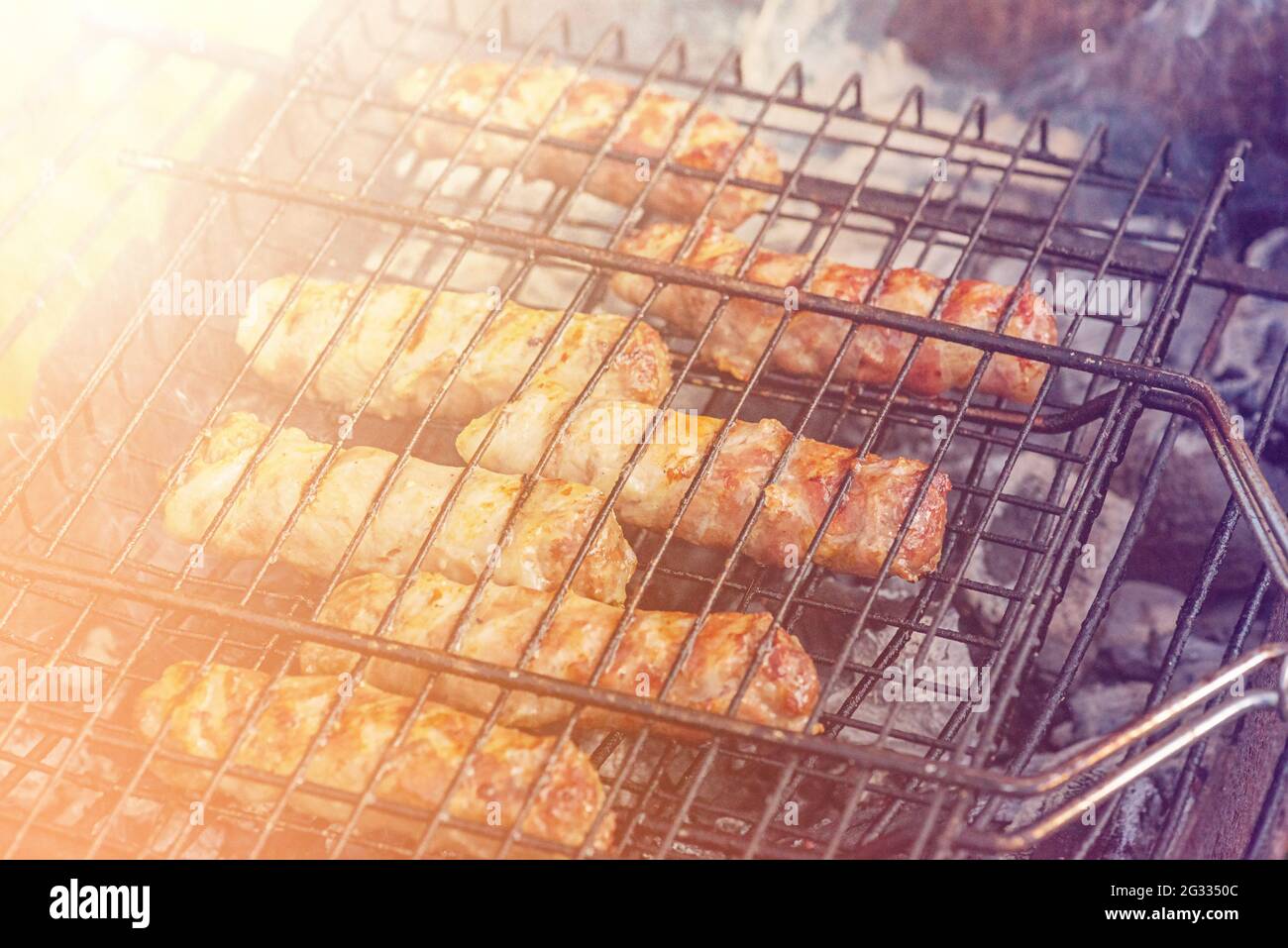 Travel kielbasa cooking. Uncooked sausages for barbecue. barbecue, meal