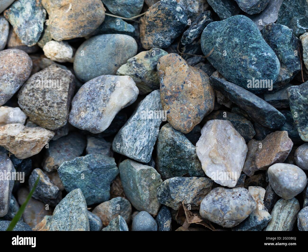 colored stones scattered on the ground Stock Photo