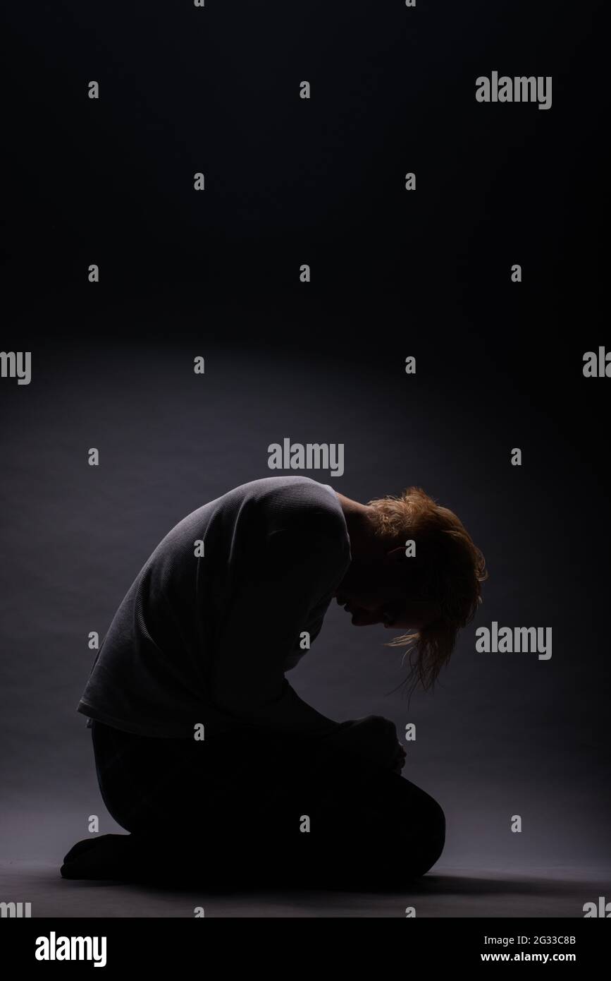 Silhouette Of Sad Boy Depressing Over The Loss Of His Love Stock Photo -  Alamy