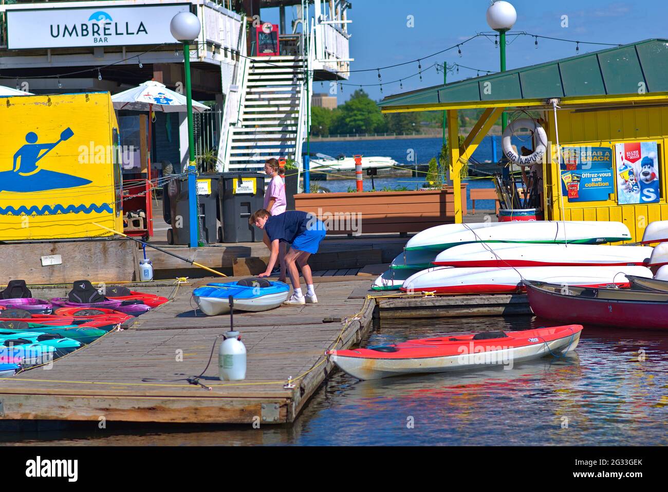Boat rental in the time of COVID. Disinfectant and masks as staff prepare the kayaks for a sunny day on Dow's Lake, Ottawa, Canada. Stock Photo