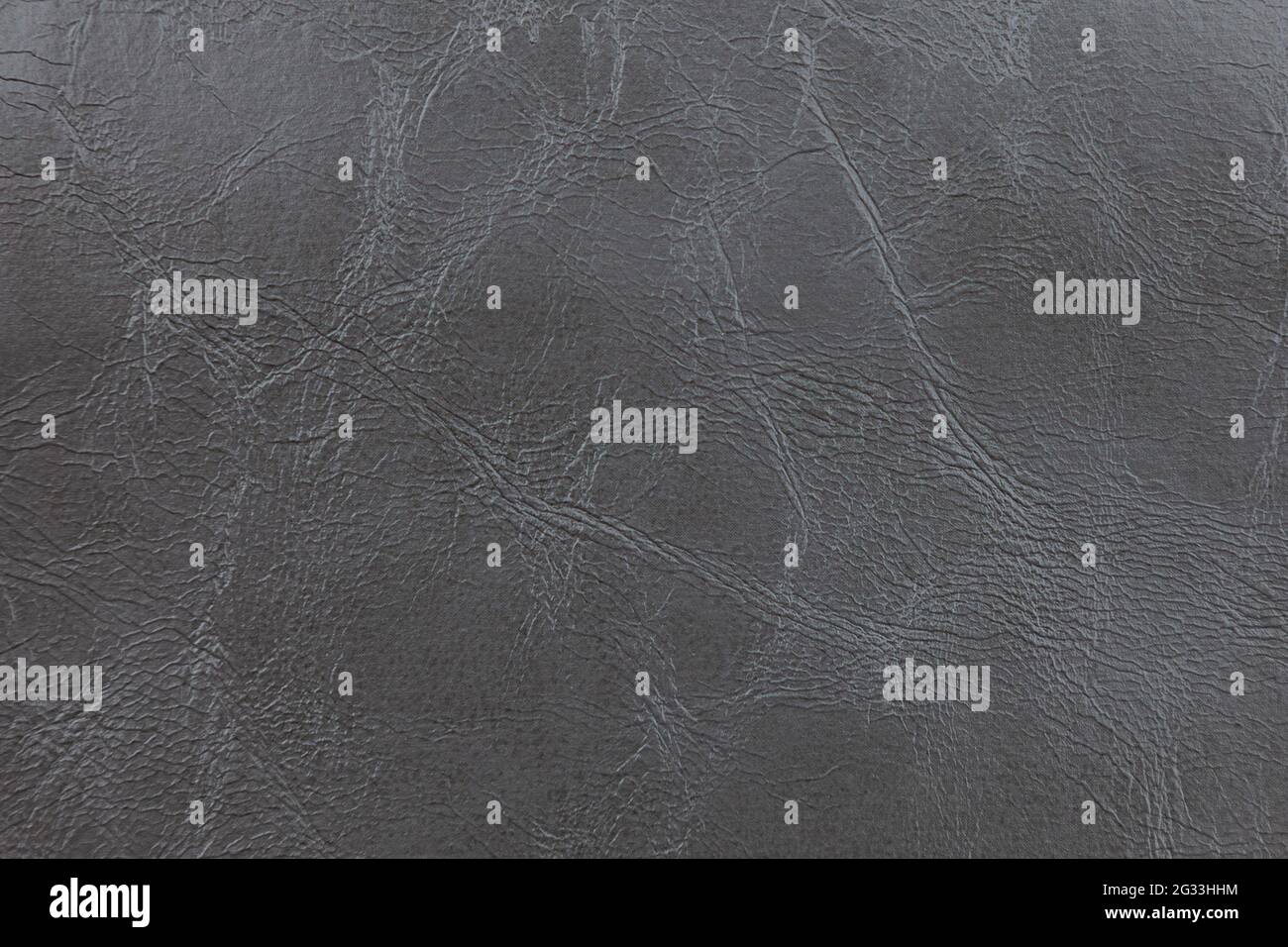 Background image - dark gray leather with textured abstract pattern. Stock Photo