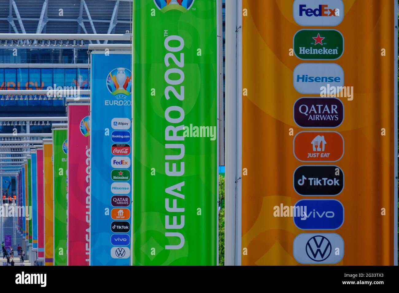 Colourful banners for the Euro 2020 football tournament featuring sponsor's names, line Olympic Way on the approach to Wembley Stadium. Stock Photo