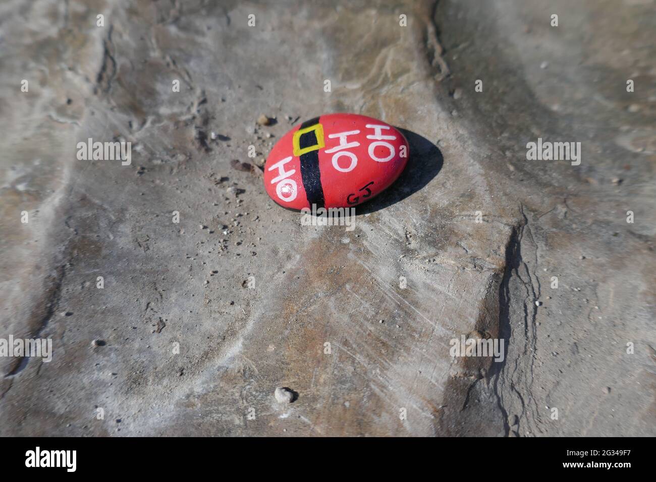 Kindness rock with Santa Clause ho ho ho message painted on Stock Photo