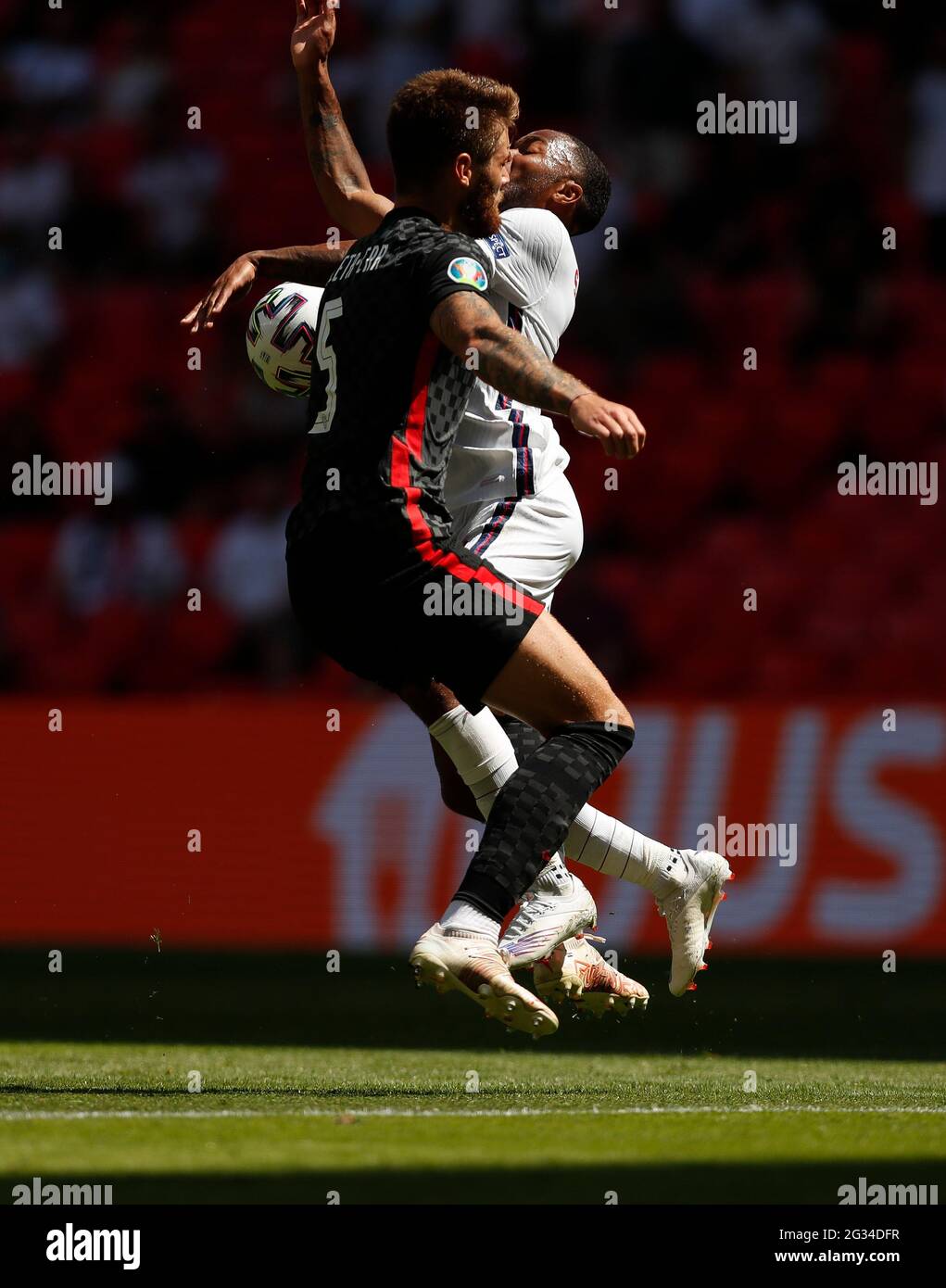 London, Britain. 13th June, 2021. England's Raheem Sterling (R) vies with Croatia's Duji Caleta-Car during the Group D match between England and Croatia at the UEFA Euro 2020 Championship in London, Britain, on June 13, 2021. Credit: Han Yan/Xinhua/Alamy Live News Stock Photo