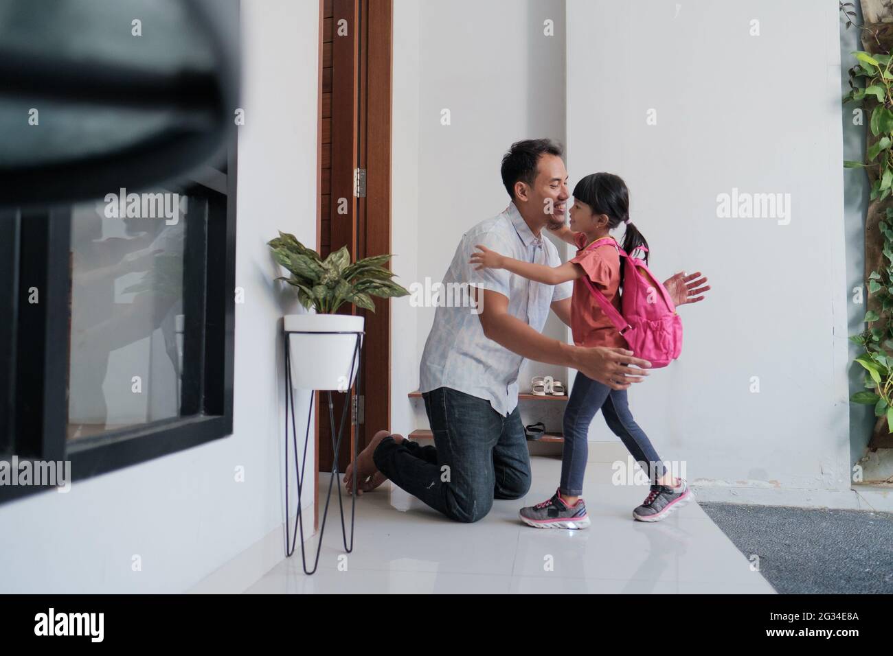 happy father welcoming his kid after finishing school Stock Photo