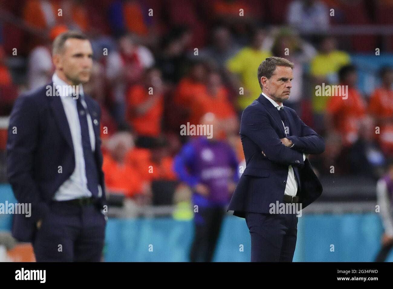 Amsterdam, Netherlands. 13th June, 2021. Coach Frank de Boer (R) of the Netherlands and Coach Andriy Shevchenko of Ukraine watch the UEFA Euro 2020 Championship Group C match between the Netherlands and Ukraine in Amsterdam, the Netherlands, June 13, 2021. Credit: Zheng Huansong/Xinhua/Alamy Live News Stock Photo