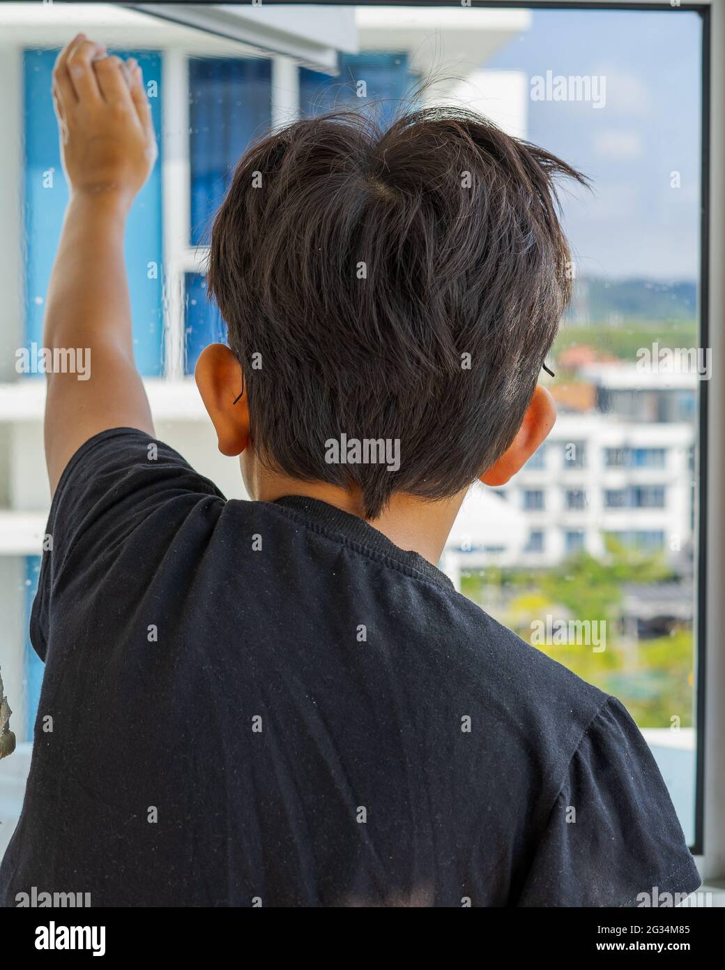 Young boy standing alone looking out of the window in an apartment during coronavirus pandemic lockdown Stock Photo - Alamy Young boy standing alone looking out of the window in an apartment during coronavirus pandemic lockdown Stock Photo - Alamy