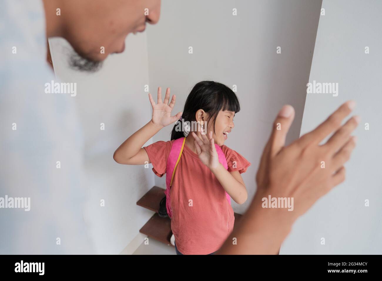 abusive parent try to hit his kid at home Stock Photo
