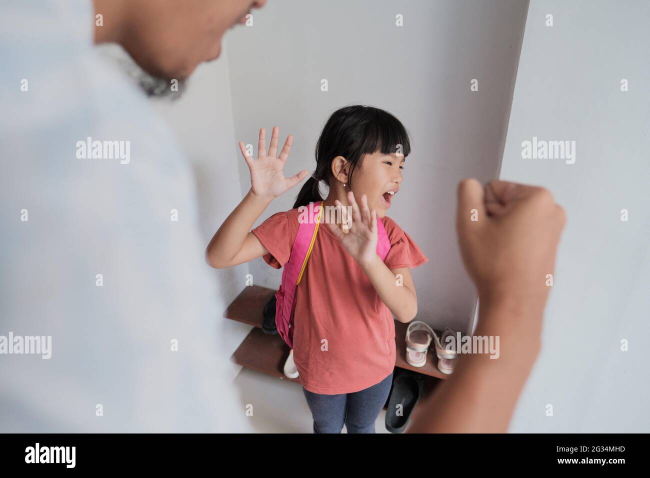 abusive parent try to hit his kid at home Stock Photo
