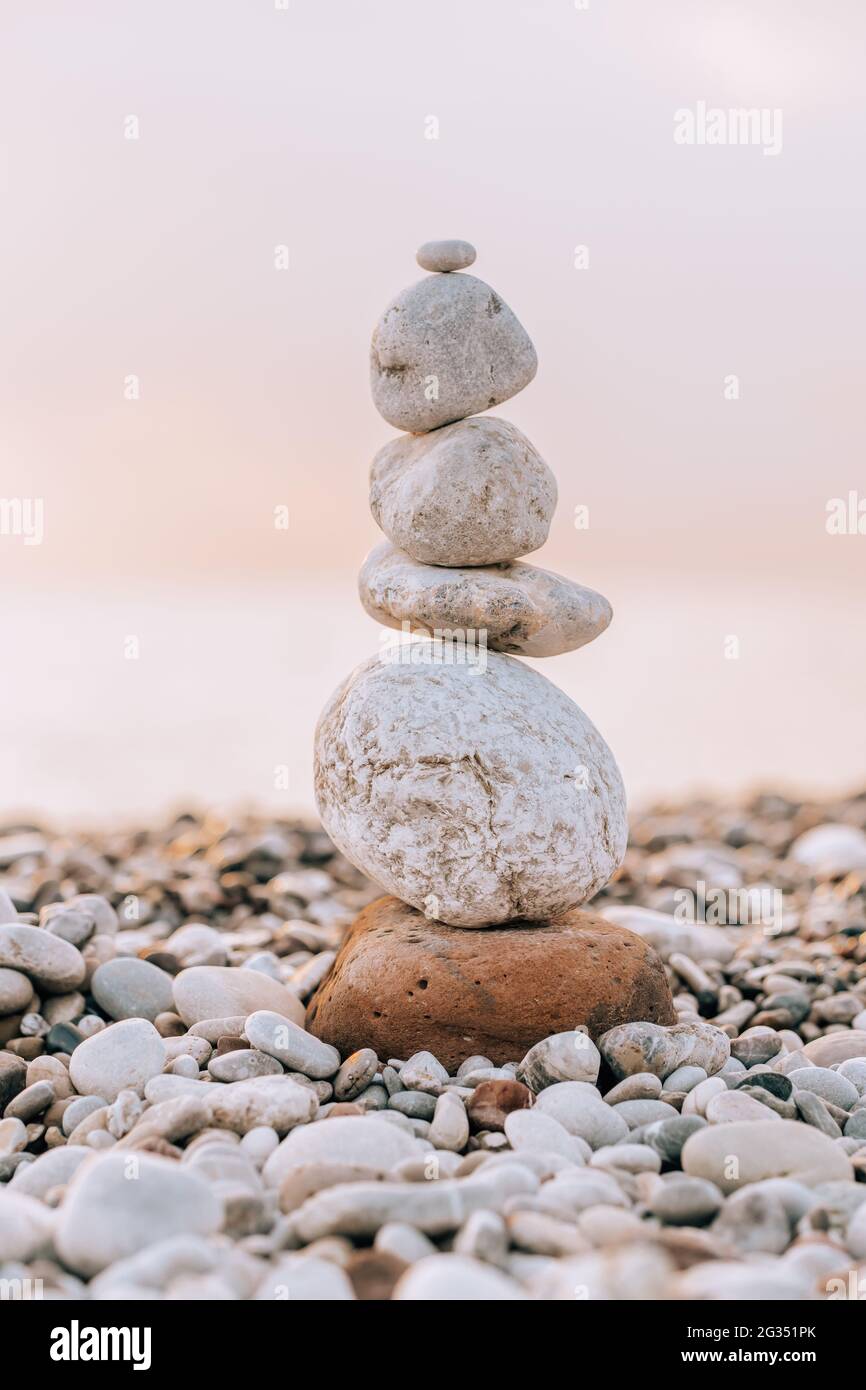 Balance stones on the beach at sunrise Stock Photo