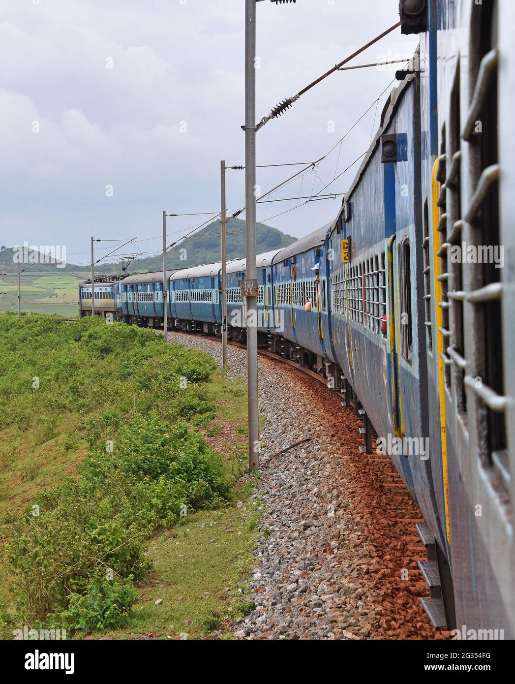 Indian Railways train Kirandul Passenger running through Araku Valley, Andhra Pradesh, India Stock Photo