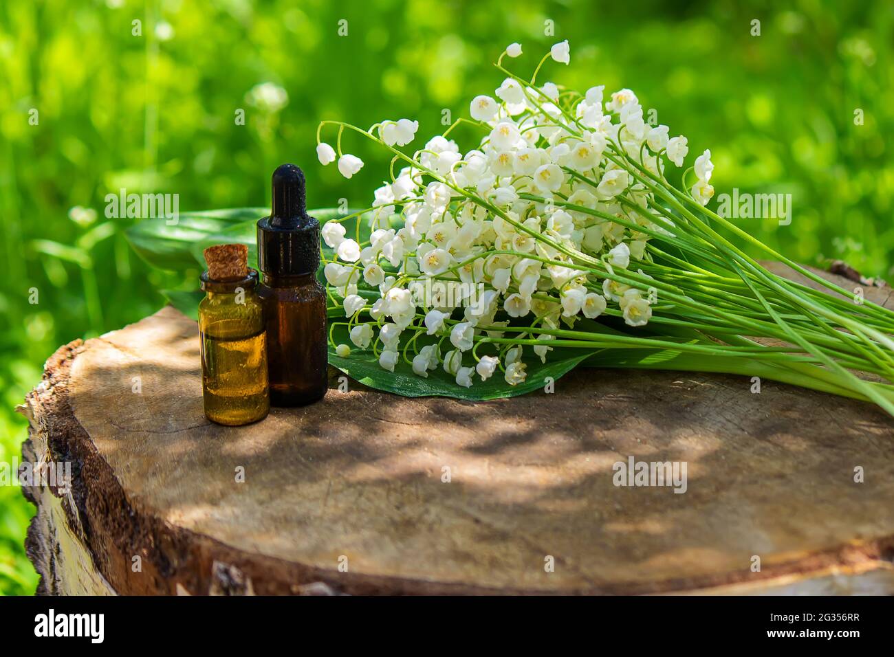 Lily of the valley essential oil in a small bottle. Selective