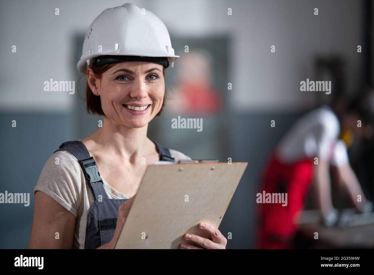 Woman worker industry helmet hi-res stock photography and images - Alamy