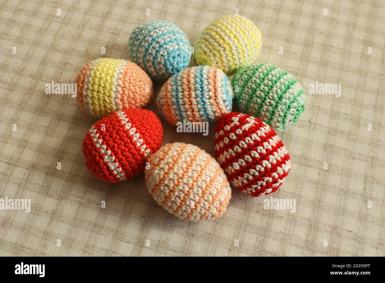 Knitted Easter eggs. Homemade eggs. Stock Photo