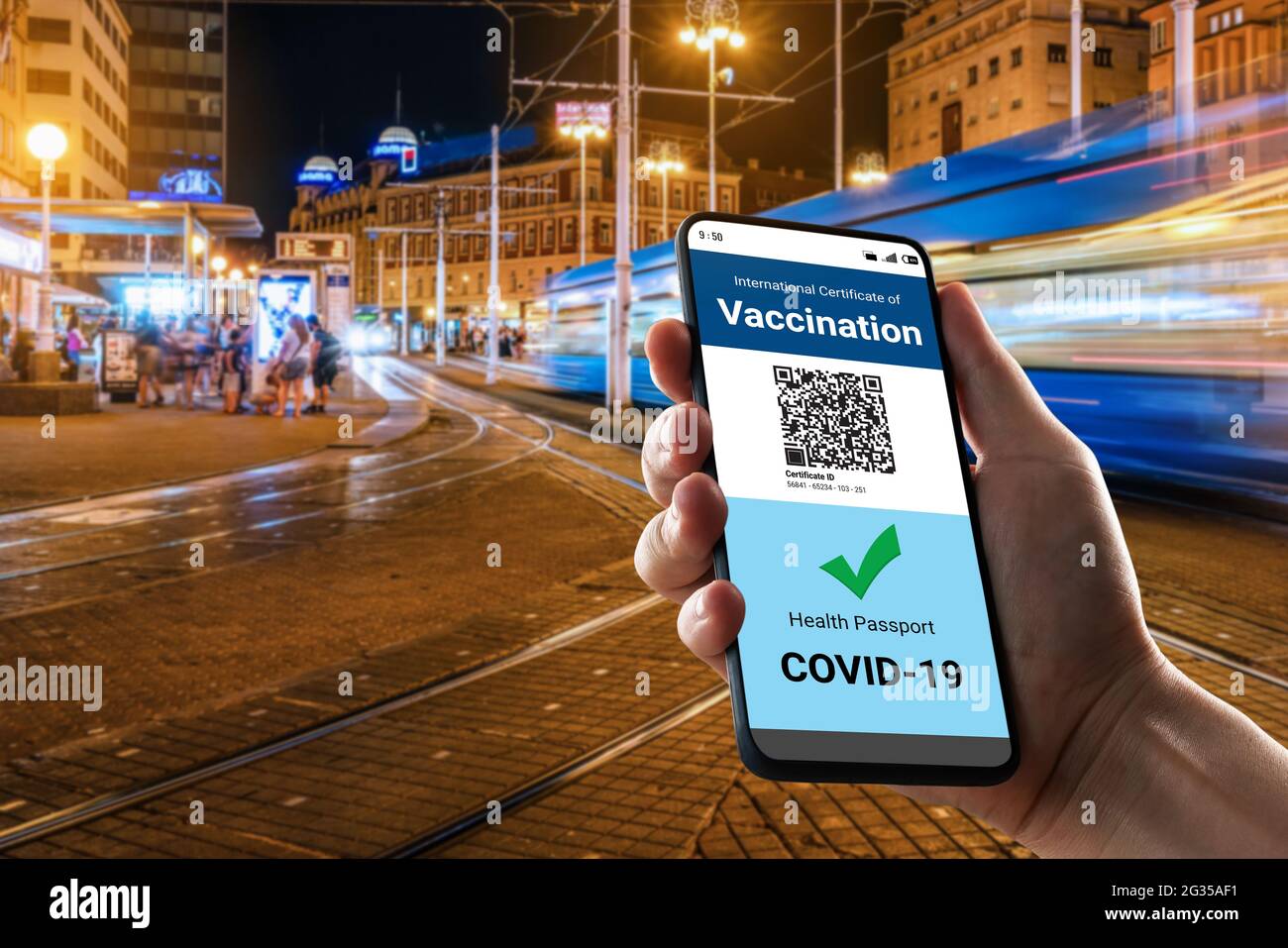 Traveler holds vaccine passport certificate to show COVID 19 vaccination status . The digital health certificate is required for international travel Stock Photo