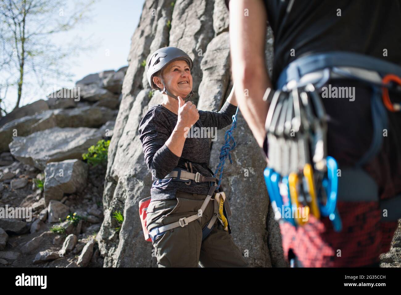 Old woman climbing rope hi-res stock photography and images - Alamy
