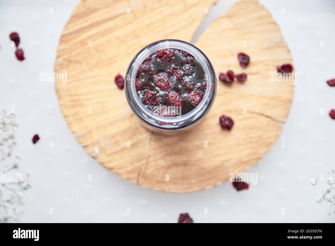 Healthy fermented honey product with cranberry. Food preservative at home, cozy, rustic flat lay. Fermentation process. Delicious recipe concept. Anti-viral food. Stock Photo