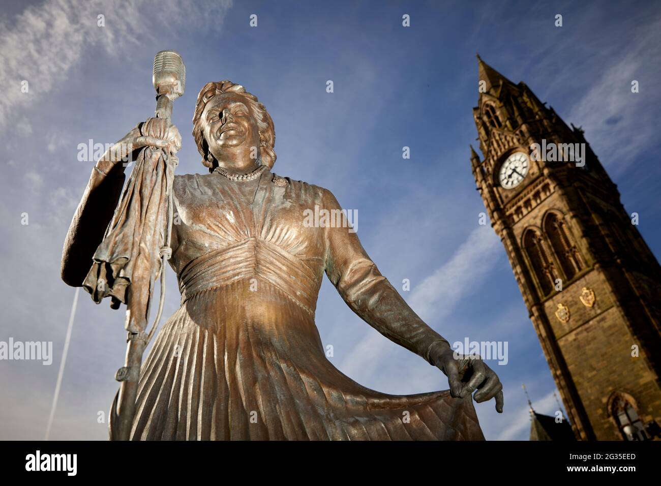 Grade I listed Manchester, Rochdale town hall clocktower and Dame Gracie Fields statue by sculptor Sean Hedges-Quinn Stock Photo