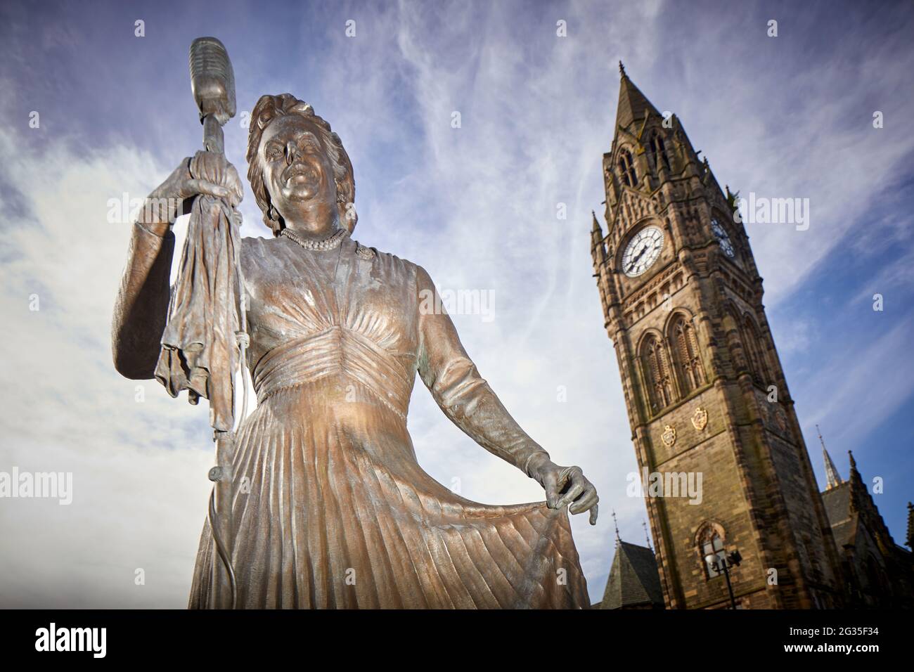 Grade I listed Manchester, Rochdale town hall clocktower and Dame Gracie Fields statue by sculptor Sean Hedges-Quinn Stock Photo