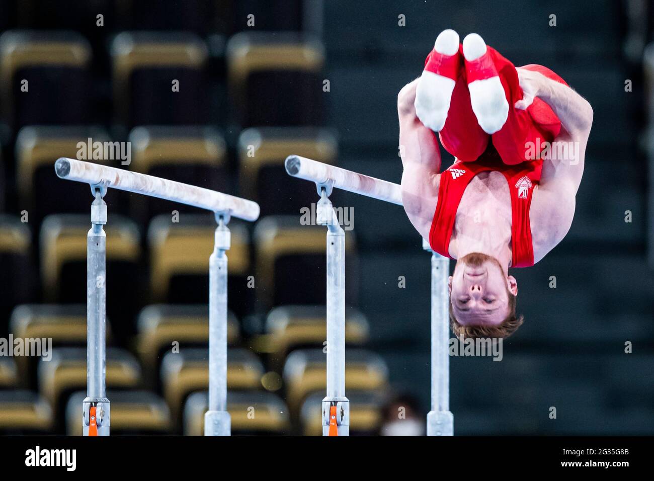 Munich, Germany. 12th June, 2021. Gymnastics: Olympic qualification, men: Leonard Prügel in action on parallel bars. Credit: Tom Weller/dpa/Alamy Live News Stock Photo
