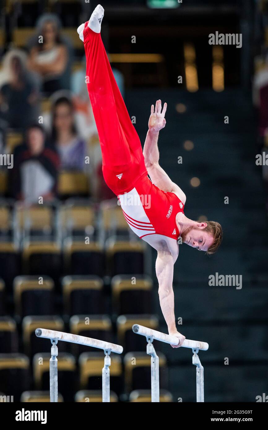Munich, Germany. 12th June, 2021. Gymnastics: Olympic qualification, men: Leonard Prügel in action on parallel bars. Credit: Tom Weller/dpa/Alamy Live News Stock Photo