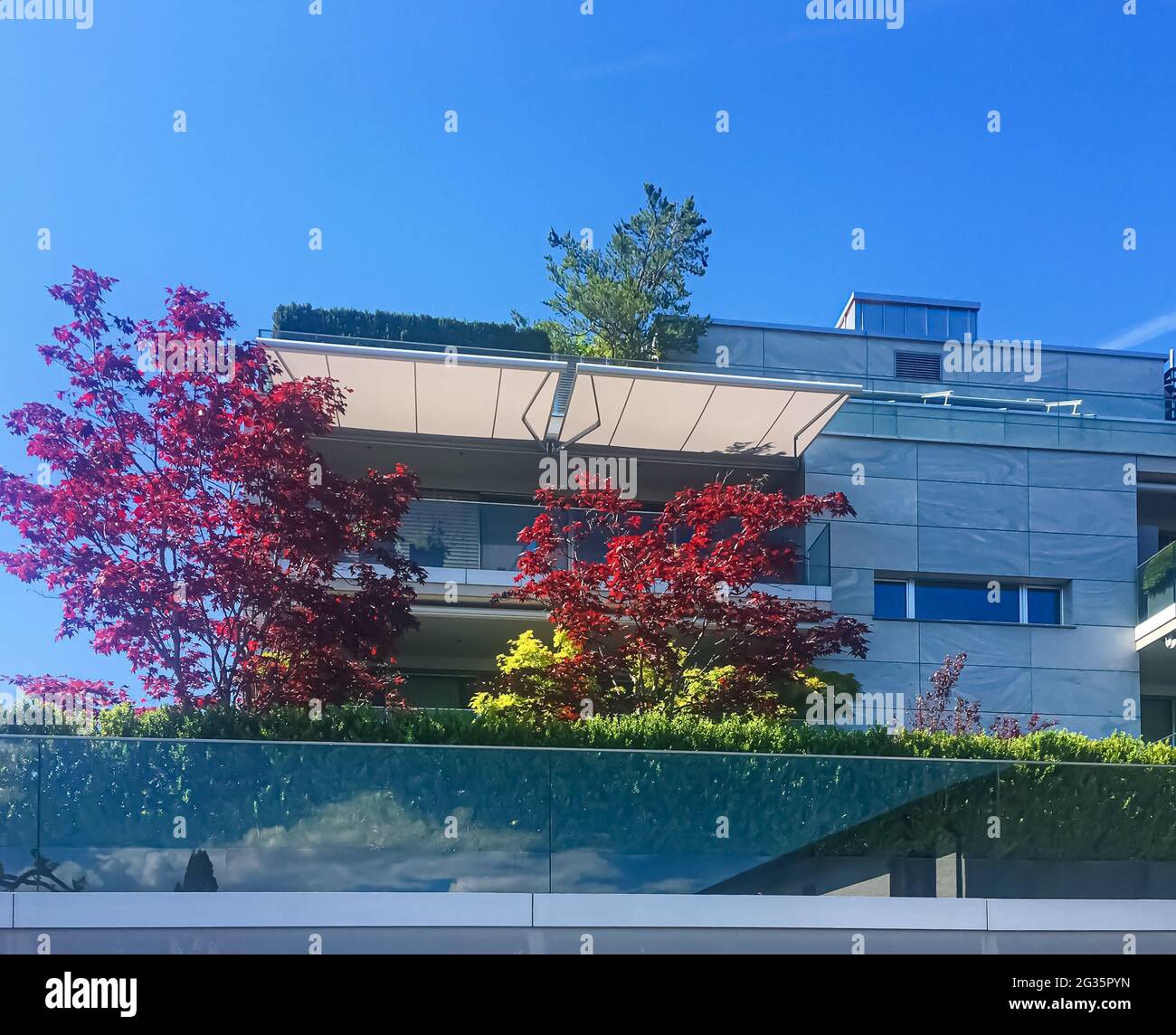 Modern apartment buildings and street in Wollerau, canton of Schwyz in  Switzerland, Swiss architecture and real estate Stock Photo - Alamy