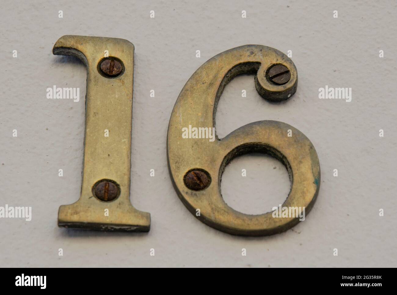 A sign on a wall with the number Stock Photo - Alamy