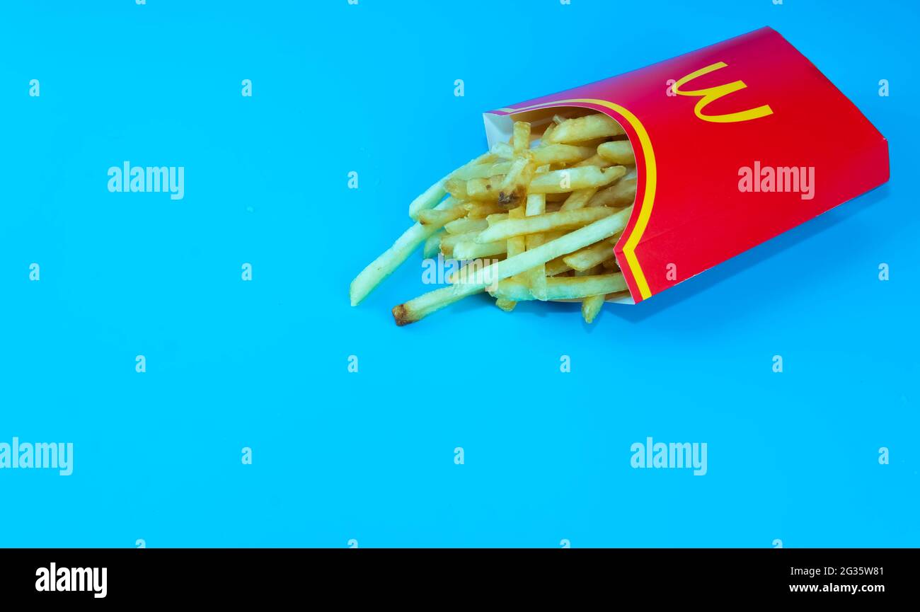 Rawang, Selangor,Malaysia, 13th June 2021 - Selective focus of McDonald's French fries in a yellow potato box. McDonald's Corporation is the largest f Stock Photo
