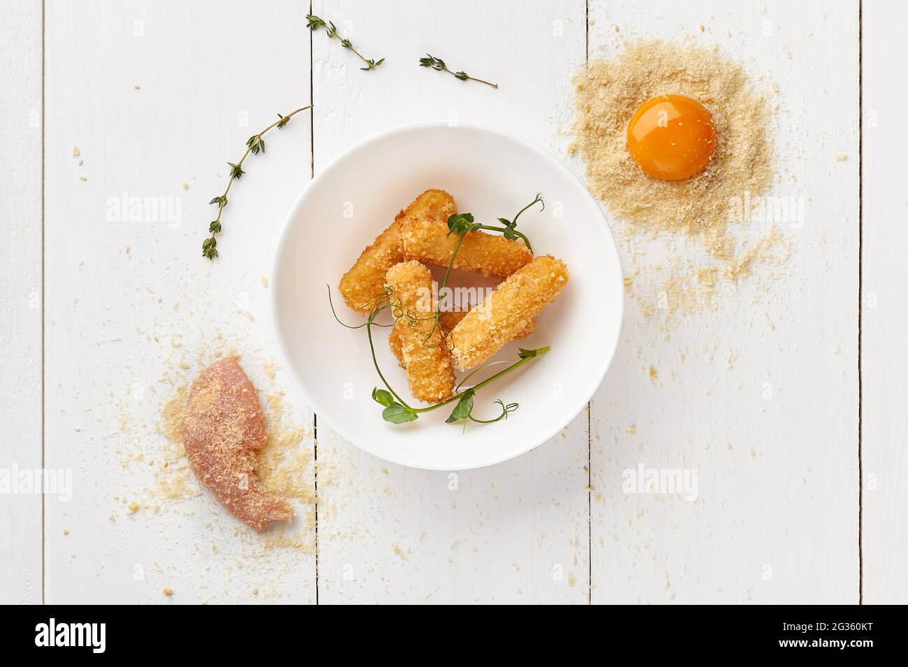 Deepfried chicken sticks battered in egg and bread crumbs Stock Photo