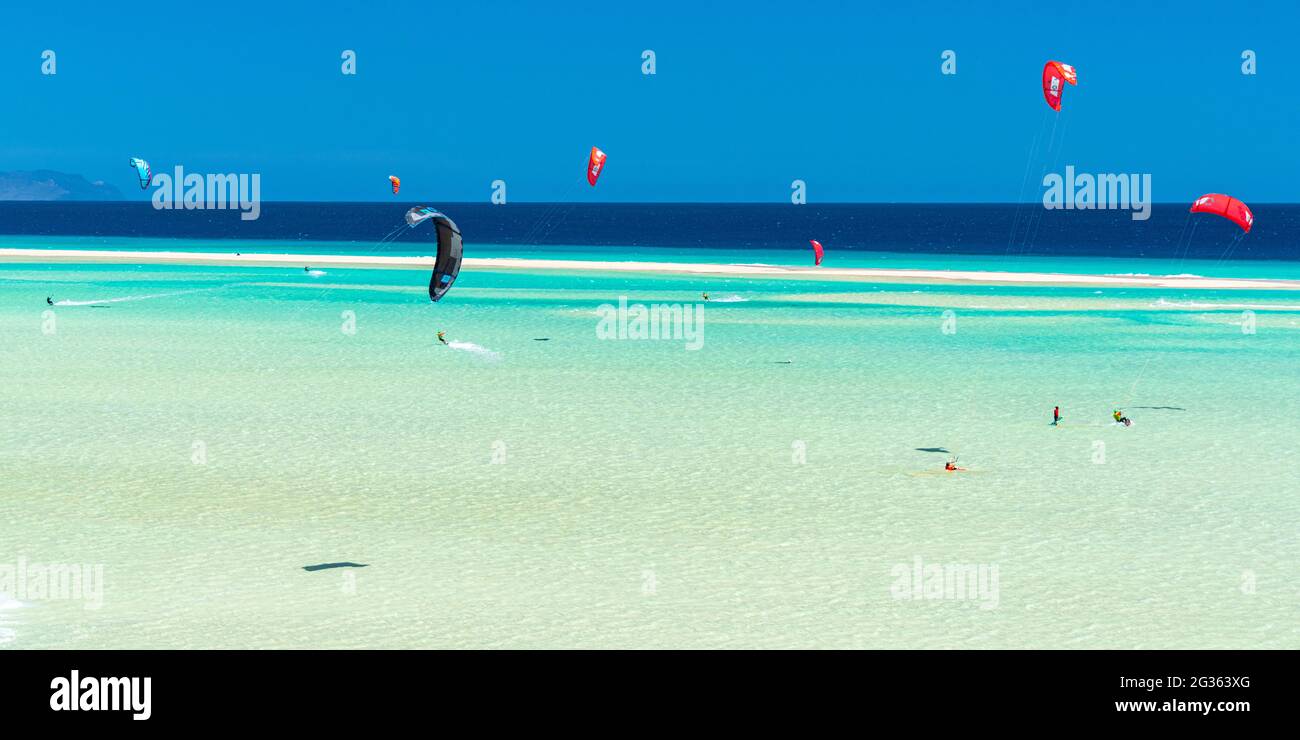 Kitesurf into the shallow turquoise sea at Sotavento beach, Jandia, Fuerteventura, Canary Islands, Spain Stock Photo