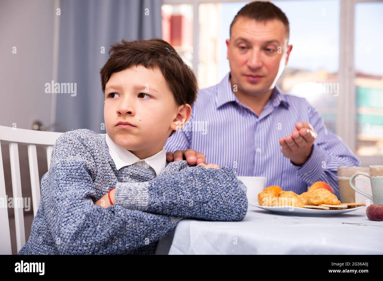 Troubled boy scolded by father Stock Photo