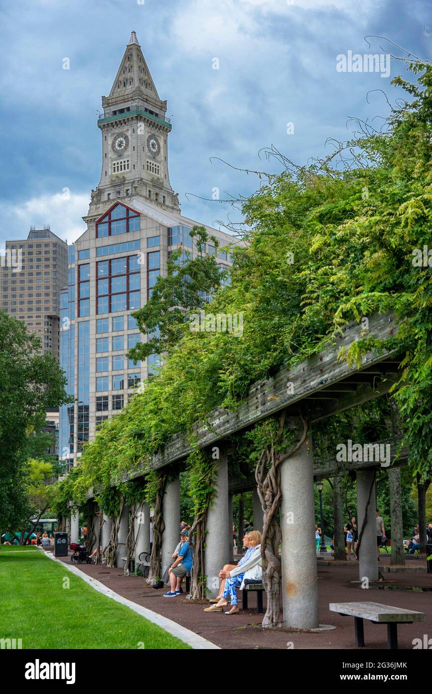 Custom House Tower The Financial District from Christopher Columbus Park, Boston, Massachusetts, USA.  Green grass park ground at Christopher Columbus Stock Photo