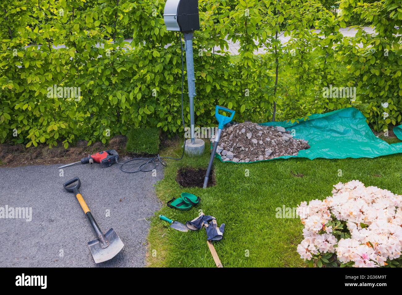 View of prepared digged whole for fundament for charging electric station. Stock Photo