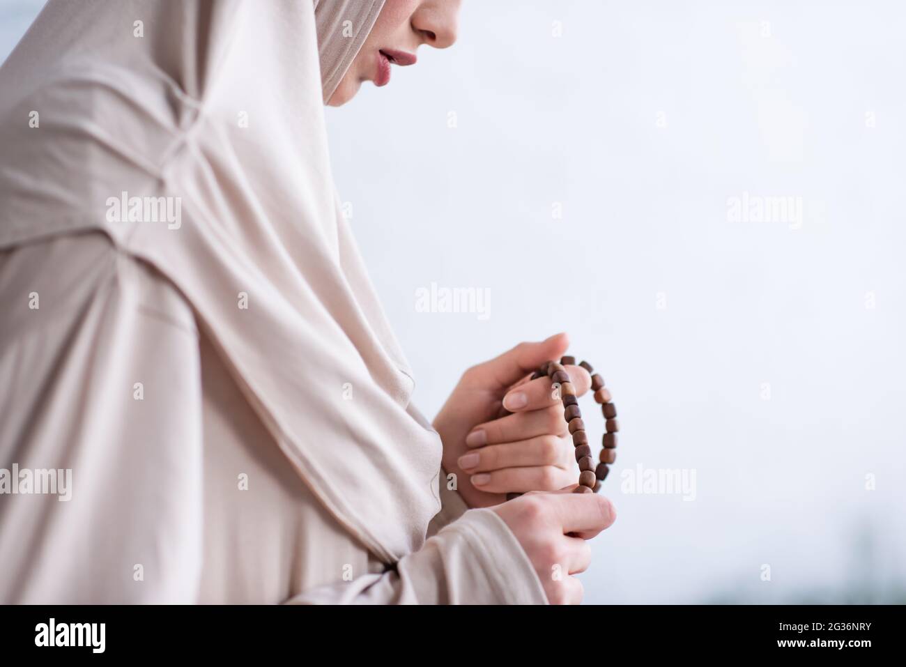 Woman holding rosary hi-res stock photography and images - Alamy