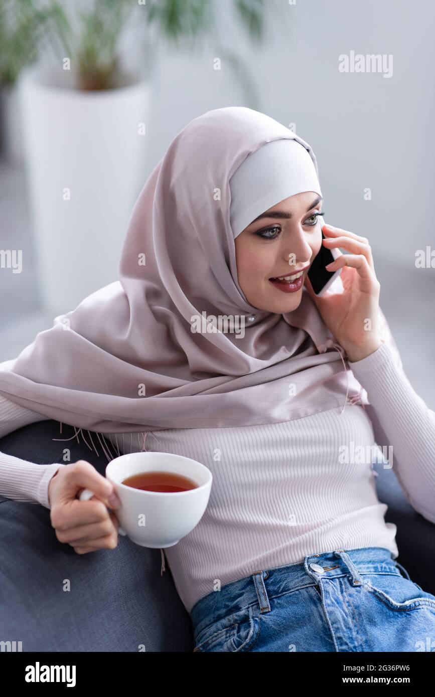 Young woman in hijab talking hi-res stock photography and images - Alamy