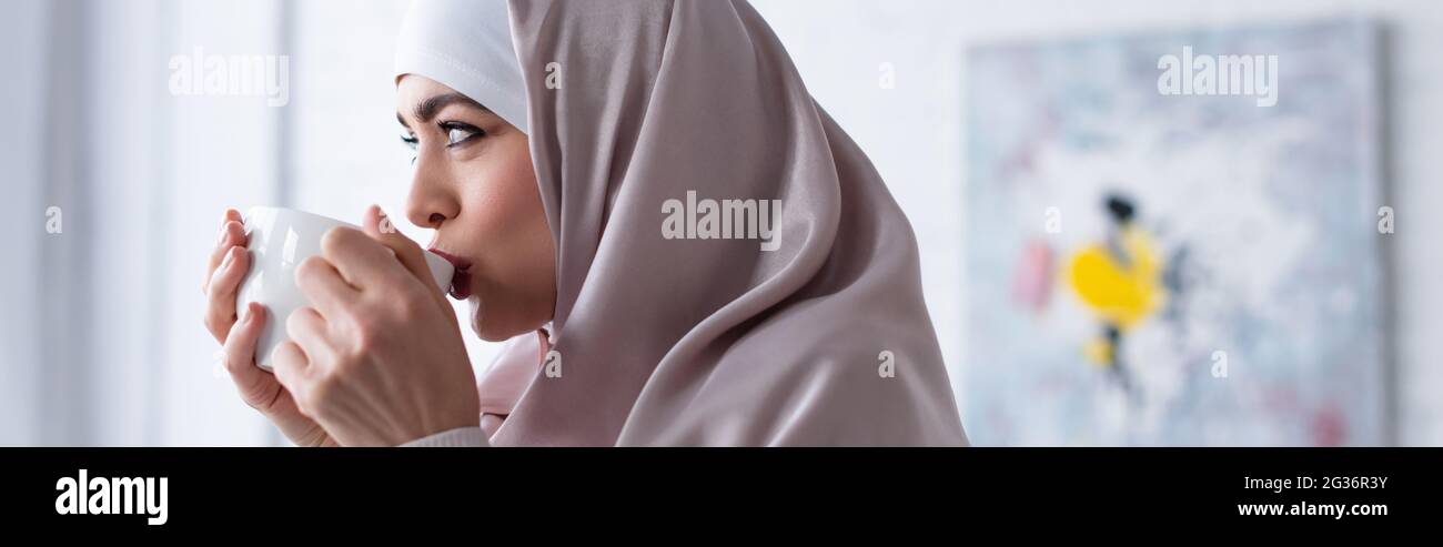 Hijab drinking hi-res stock photography and images - Alamy