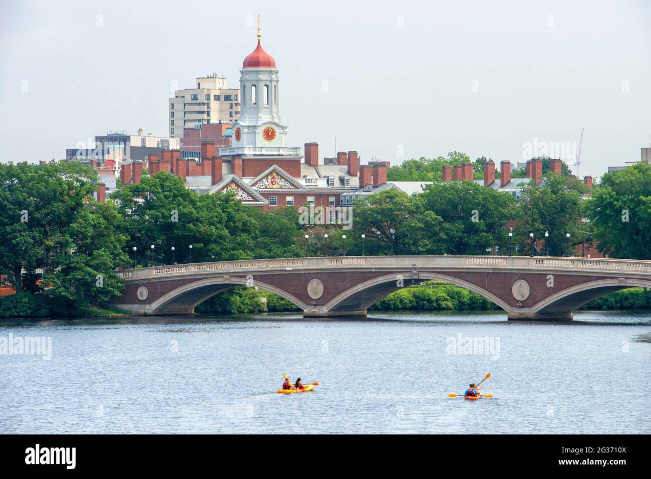 Kayaking in John W. Weeks Bridge and clock tower over Charles River in