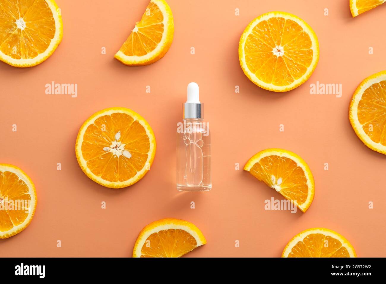 Clean dropper bottle Vitamin C extract and sliced orange top view Stock ...