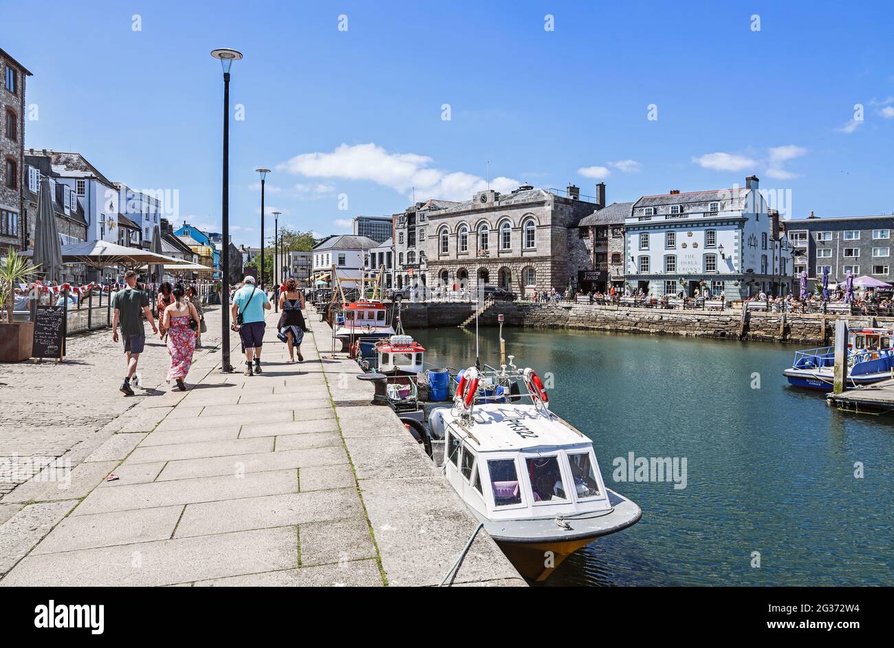 Waterside bars and restaurants on Plymouth’s Barbican, surrounding Sutton Pool make the most of an easing of Lockdown in June 2021. Stock Photo