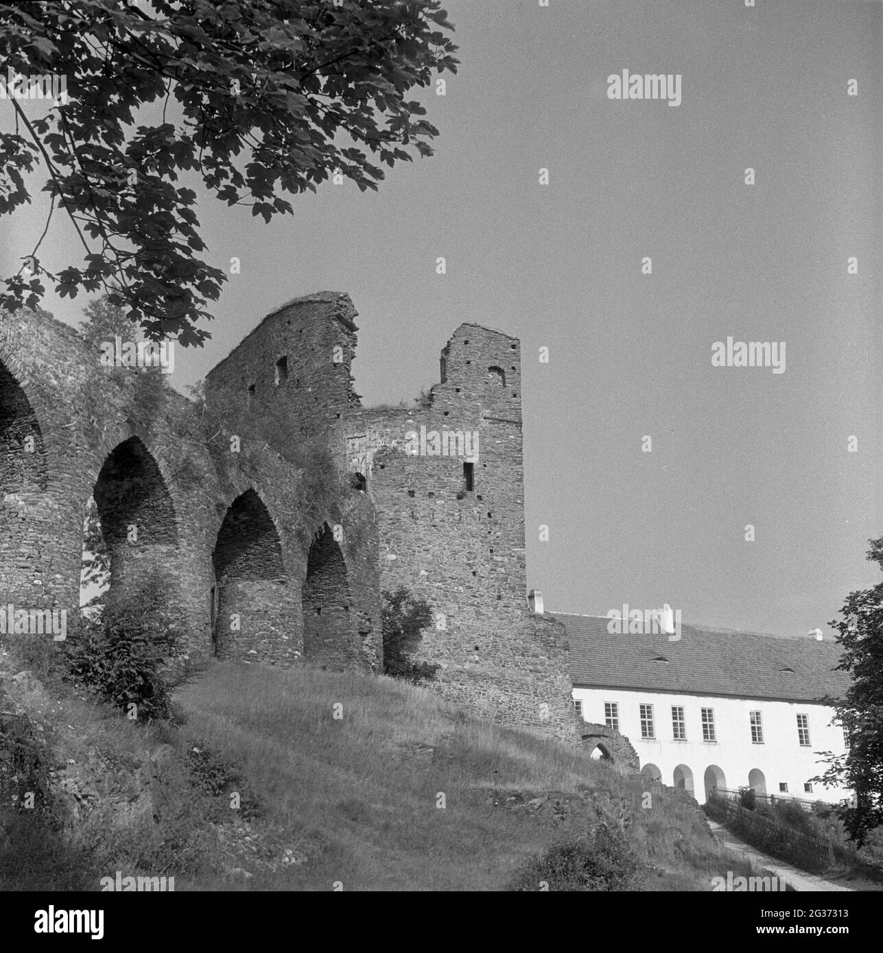 Medieval castle of Velhartice (Welhartitz) with a massive stone bridge connecting its parts. Southern Bohemia, Czechoslovakia, shot in early 1960s. Stock Photo