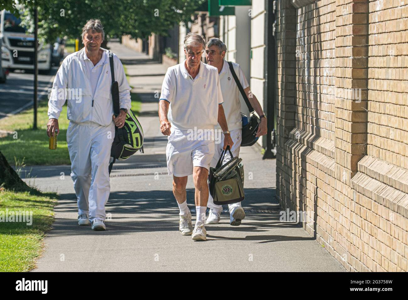 WIMBLEDON LONDON 14 June 2021. Former CEO Chris Gorringe (C) arrives with club  members for practice at the All England Lawn Tennis & Croquet Club which is  prepararing to host the championships .