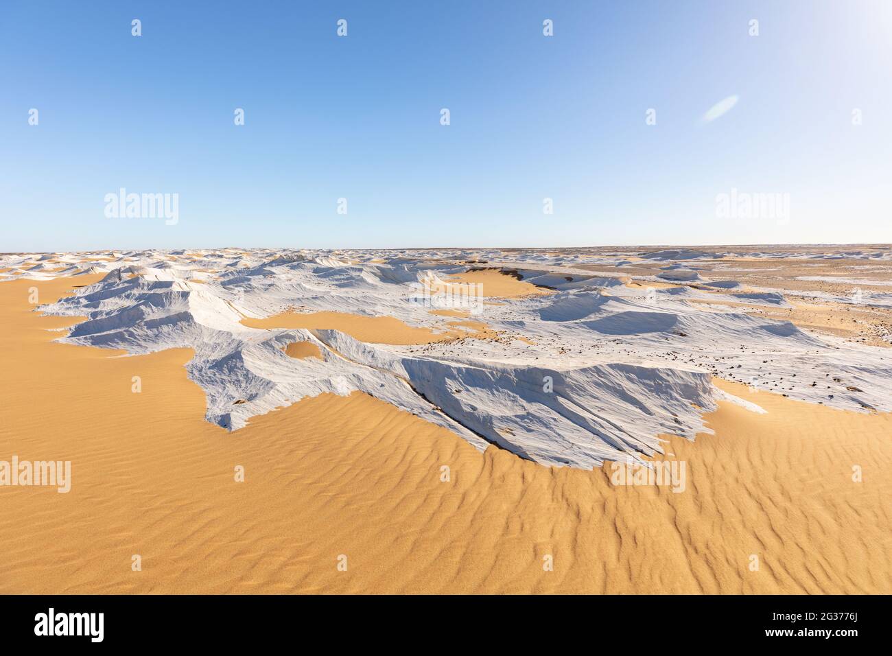 Sunny White Desert with a cloudless blue sky. Stock Photo