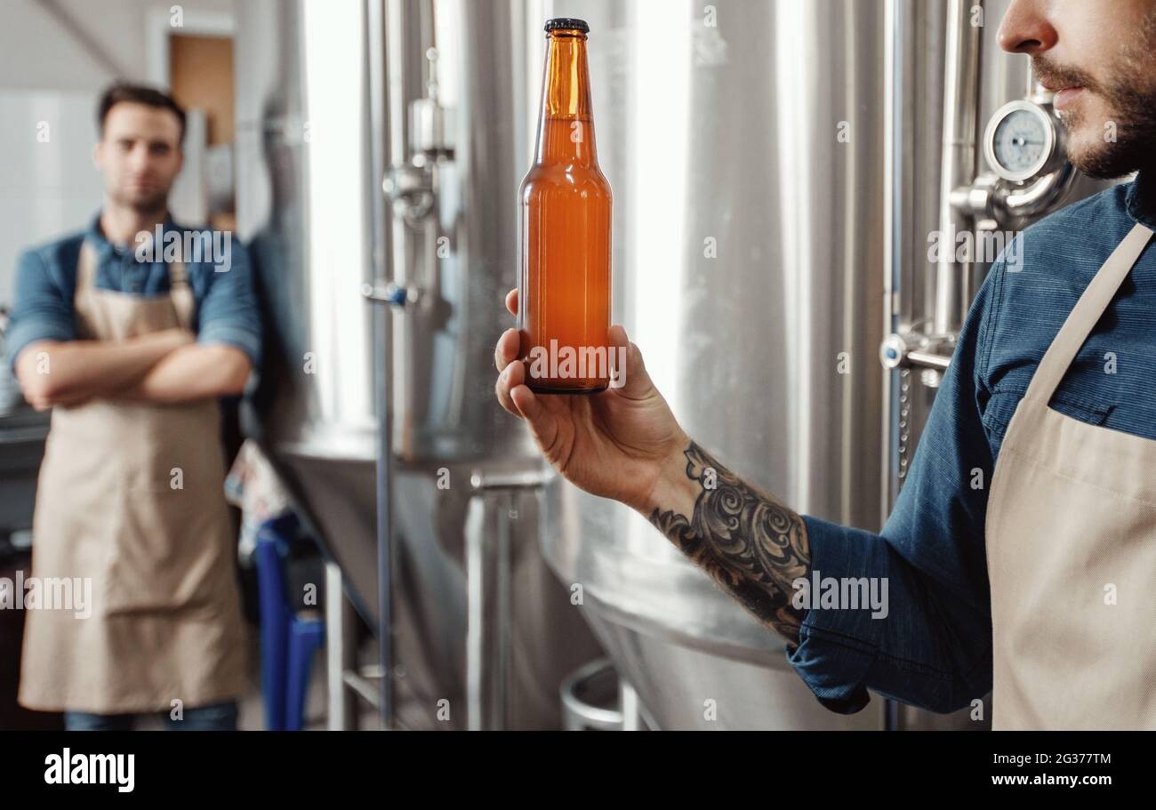 Fresh craft beer, quality control of ready to sell alcoholic beverage Stock Photo