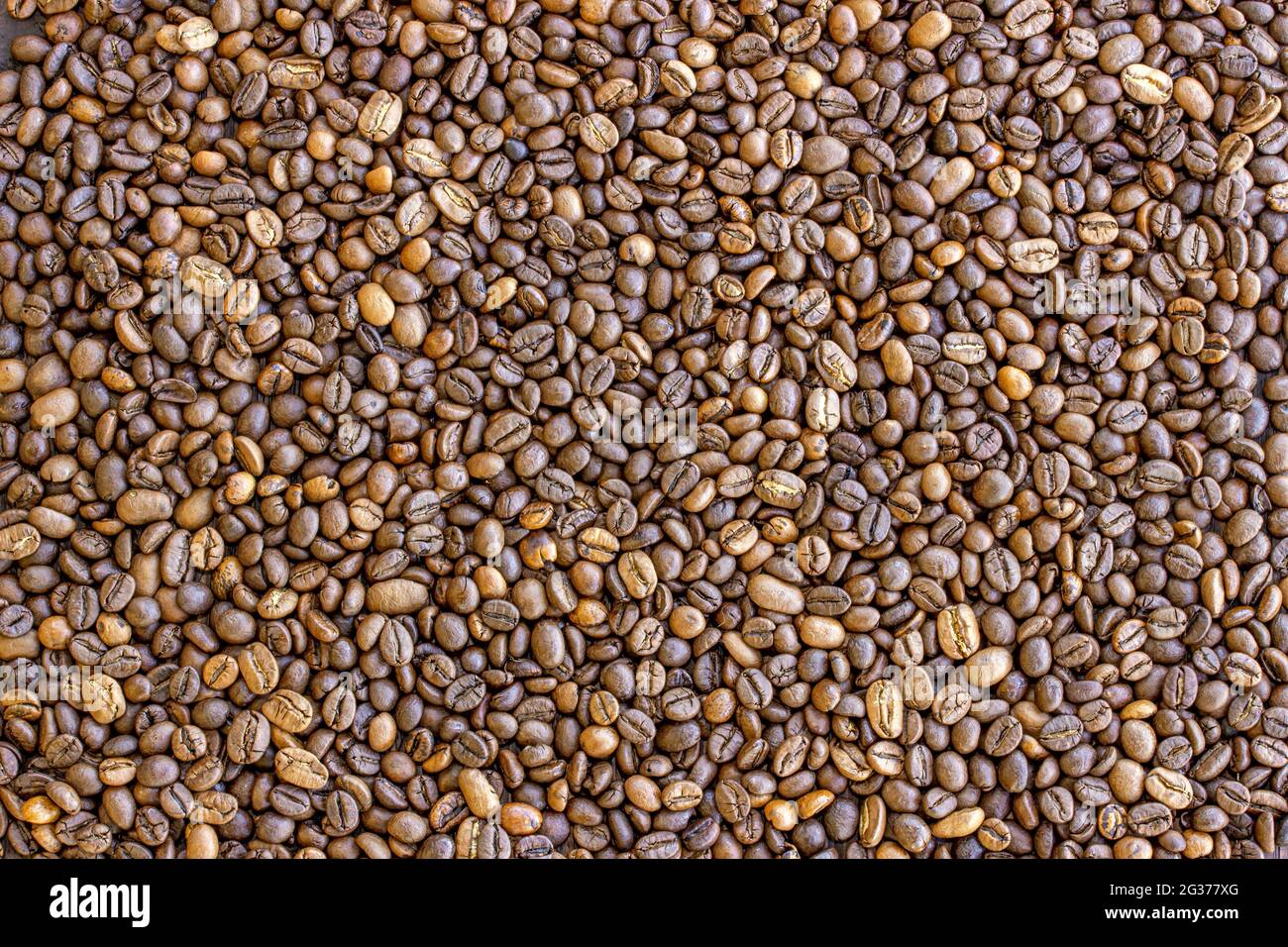 roasted coffee bean background, top view Stock Photo - Alamy