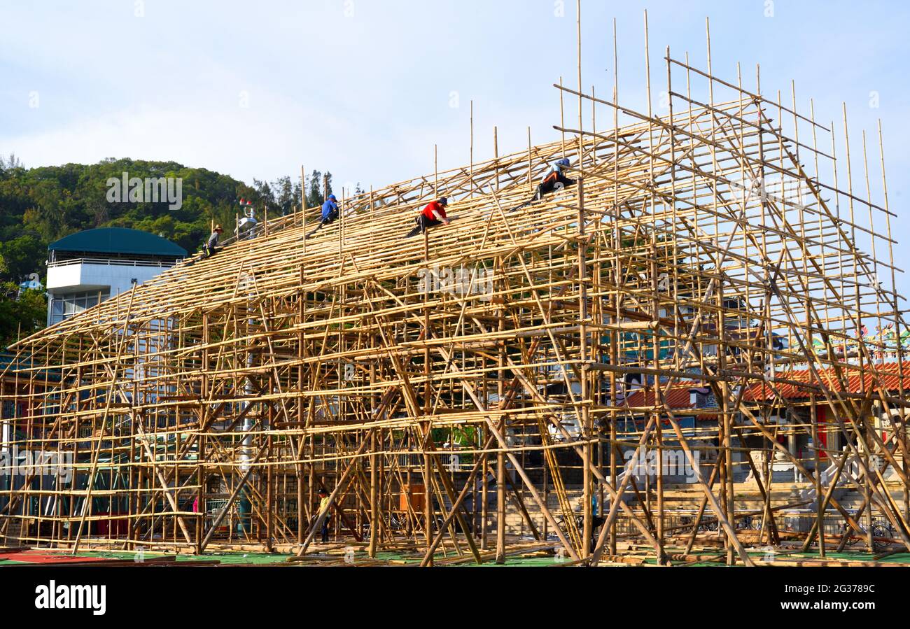 Construction of bamboo theatre in front of Pak Tai Temple for Chinese opera performance during Tai Ping Ching Jiu (aka Bun Festival) in Cheung Chau. Stock Photo