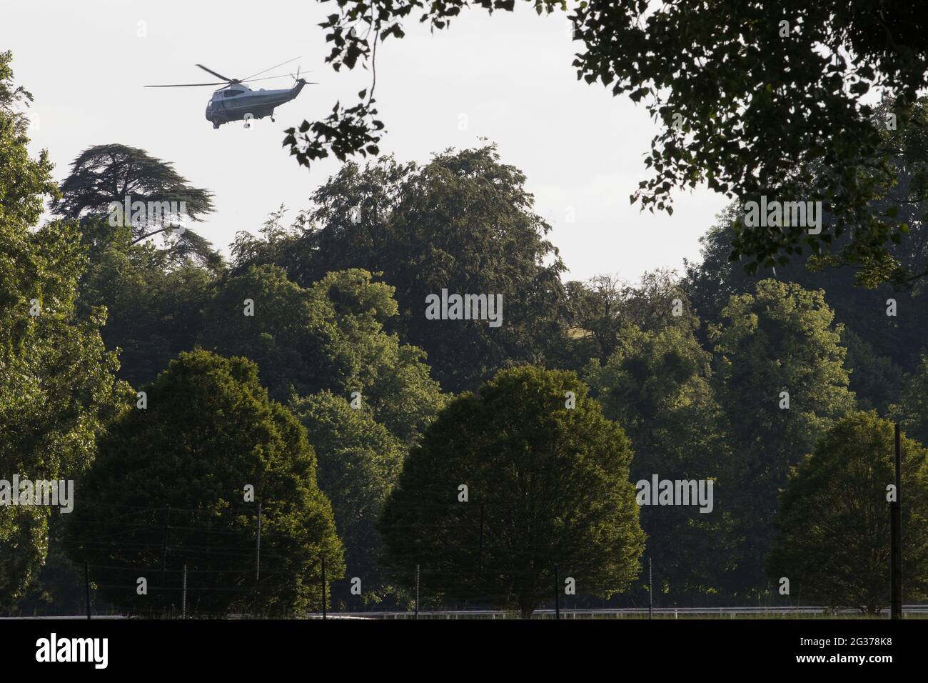 Windsor, UK. 13th June, 2021. One of President Biden's VH-3D Sea King helicopters, known as Marine One, is pictured leaving Windsor Castle. President Biden and First Lady Jill Biden were welcomed at Windsor Castle by the Queen following the G7 summit with a Guard of Honour followed by afternoon tea. Credit: Mark Kerrison/Alamy Live News Stock Photo