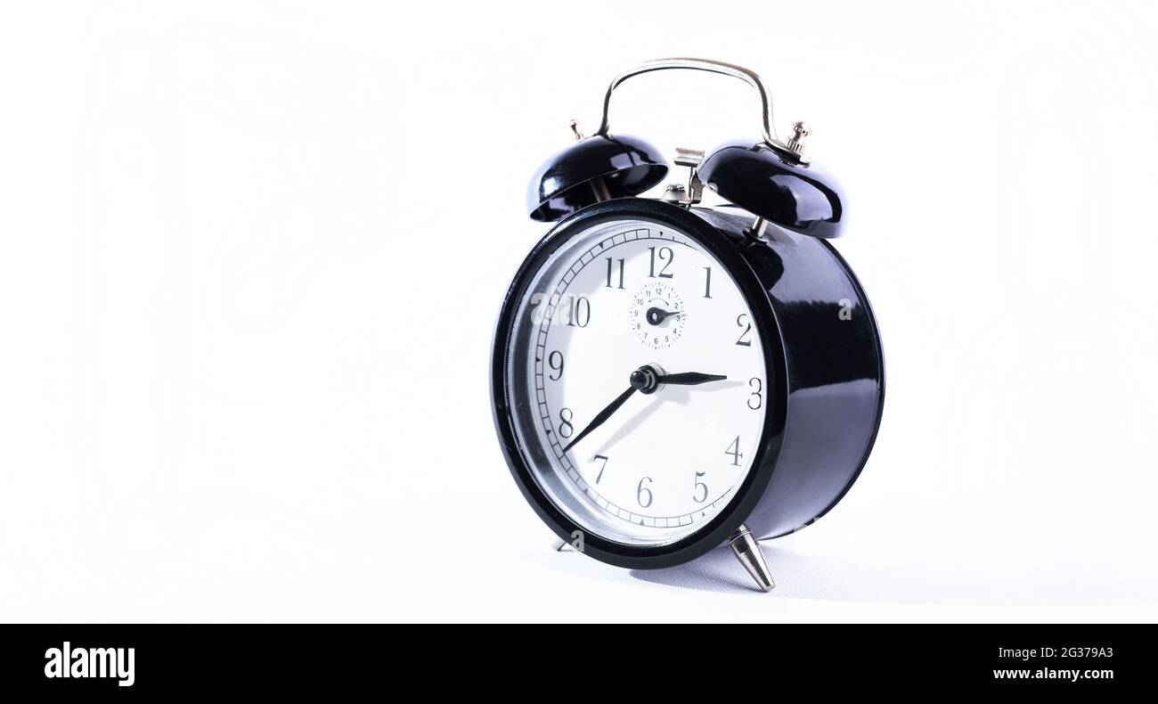 Black alarm clock isolated on a white background Stock Photo - Alamy